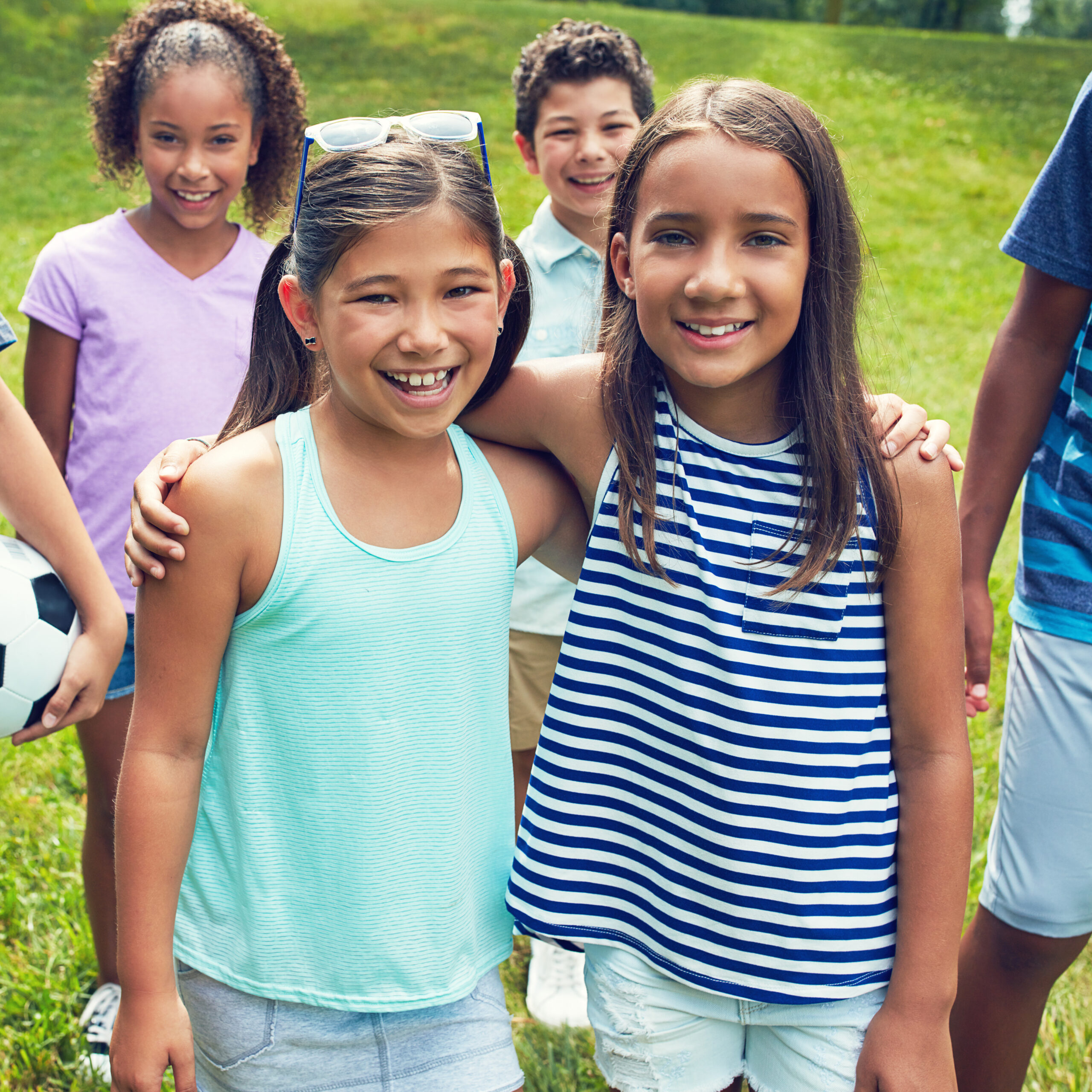 Smiling children together in a park
